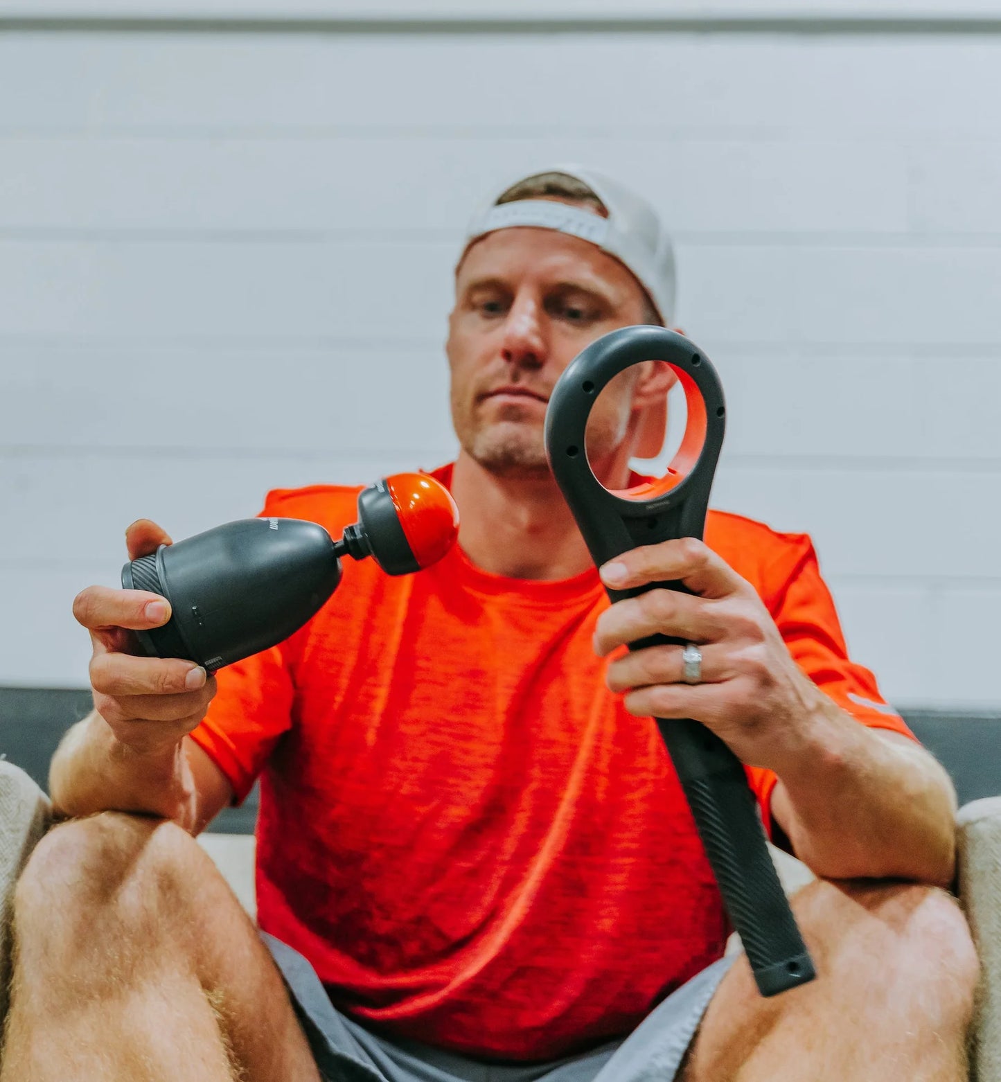 WellBody® WingSpan, a mini percussion massage device with HeatBall, detacheable extended handle, performance carry bag and 3 tip options.