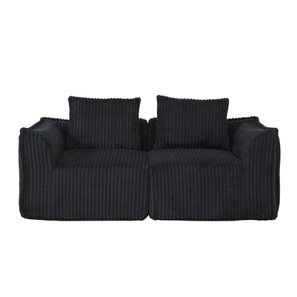 Minimalist Sofa With Curved Lines And Horn Shaped Throw Pillows